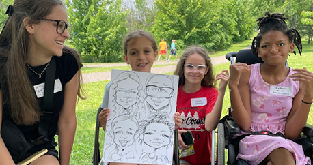 Four siblings are seated on folding chairs outside and one of them sits in her wheelchair. They are holding up a caricature artist drawing